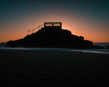 Scenic view of sea against sky at sunset