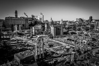 High angle view of old buildings in city against sky