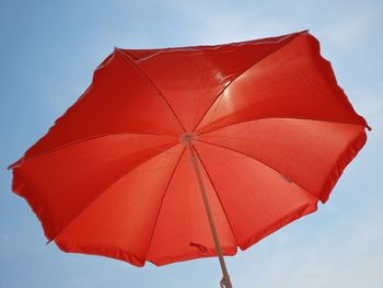 Low angle view of umbrella against sky