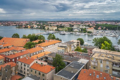 High angle view of buildings in city against sky