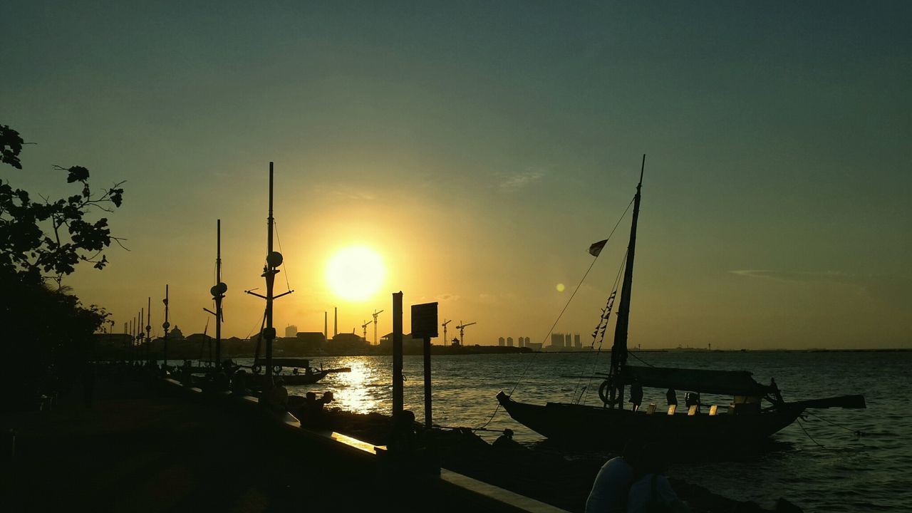 sunset, nautical vessel, sea, water, sun, boat, transportation, mode of transport, moored, scenics, beauty in nature, tranquil scene, tranquility, mast, sailboat, sky, sunlight, silhouette, nature, horizon over water