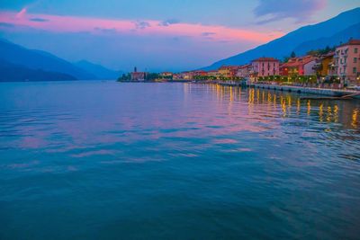 Scenic view of lake against sky at sunset