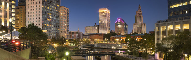 Illuminated buildings in city at night