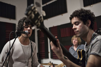 Musicians rehearsing at recording studio