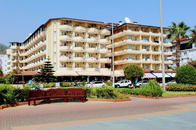 Residential buildings in town against clear sky