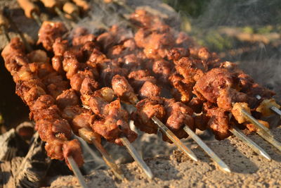 Close-up of meat on barbecue grill