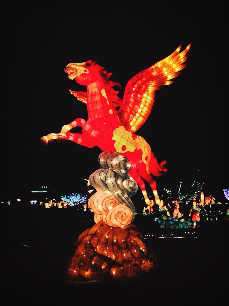 illuminated, night, sculpture, art and craft, statue, art, animal representation, creativity, human representation, decoration, celebration, no people, christmas, gold colored, christmas decoration, tradition, motion, low angle view, outdoors