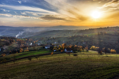 Scenic view of landscape against sky during sunset