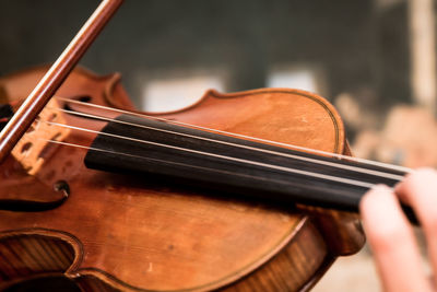 Cropped hand playing violin