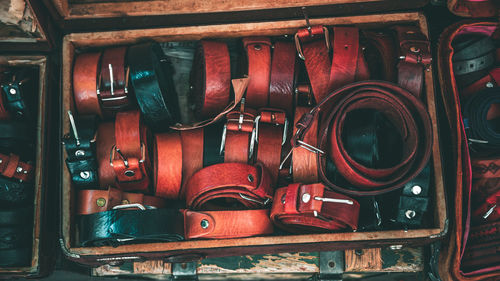 High angle view of belts in box on table