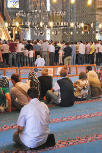 Group of people praying in the mosque