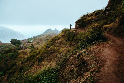 Hiker silhouette looks into the valley and listens to the silence. santo antao cape verde