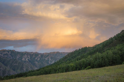 Scenic view of mountains against sky during sunset