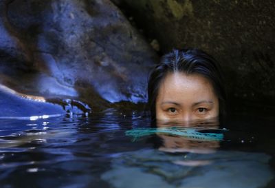 Portrait of woman swimming in sea