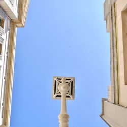 Low angle view of building against clear blue sky