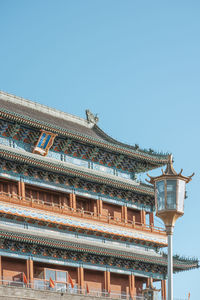 Low angle view of temple against clear blue sky