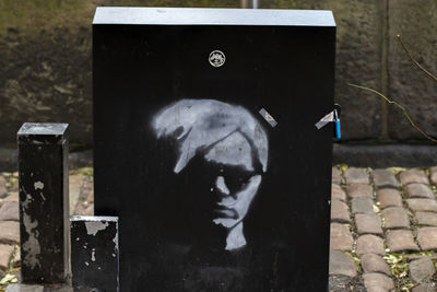 High angle view of garbage bin on stone wall
