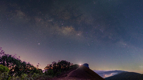 Scenic view of star field against sky at night