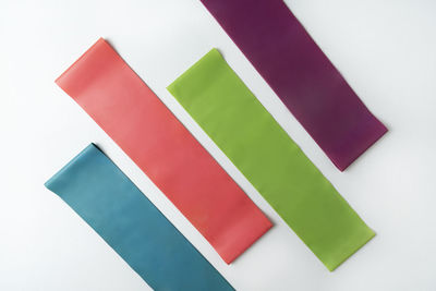 Close-up of multi colored adhesive notes on white background