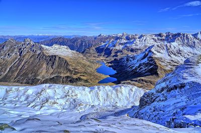 Scenic view of snowcapped mountains against sky