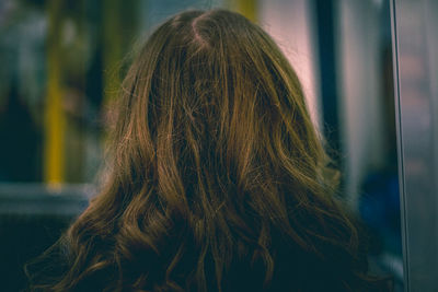 Rear view of woman standing in hair