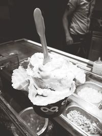 Close-up of hand holding ice cream