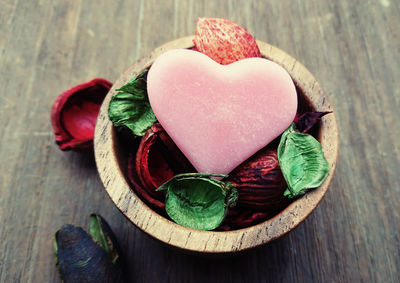 High angle view of fruits and heart shape on table