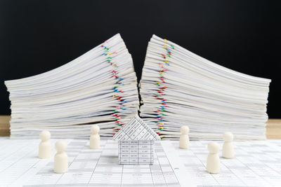 Close-up of books on table against black background