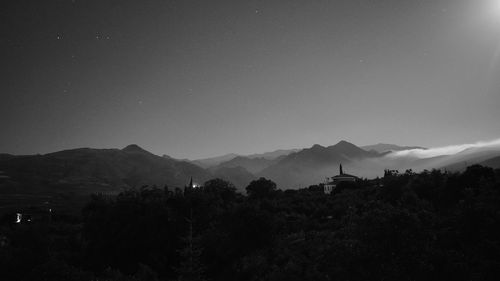Scenic view of landscape against sky at night