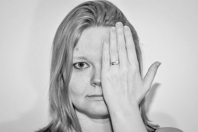 Portrait of woman against white background