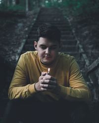 Young man smoking cigarette