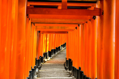 Vermillion gates at the fushimi inari shrine, kyoto, japan