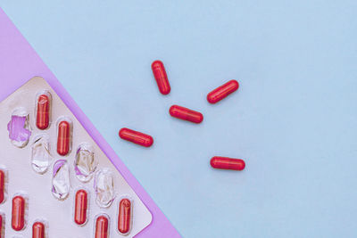 High angle view of pills on white background