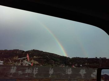 Low angle view of rainbow against sky