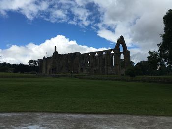 View of castle against cloudy sky