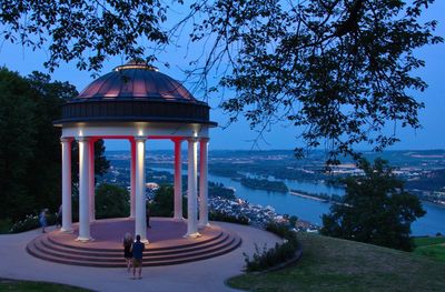 Gazebo in city against clear sky