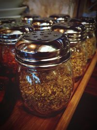 High angle view of wine in glass jar on table