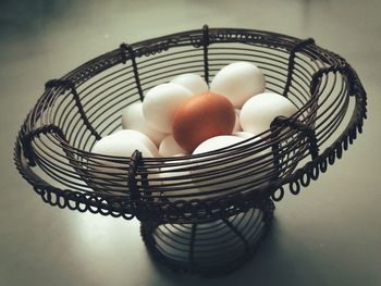 High angle view of eggs in basket on table