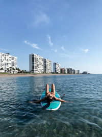 Man in swimming pool against sea