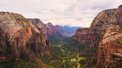 Scenic view of mountain against cloudy sky