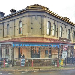 Graffiti on building in city against sky