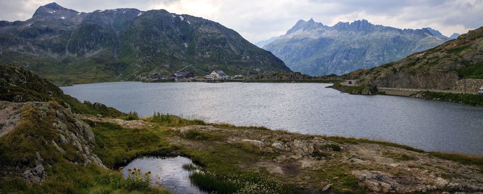 Scenic view of lake and mountains against sky