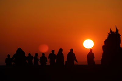 Silhouette people at sunset