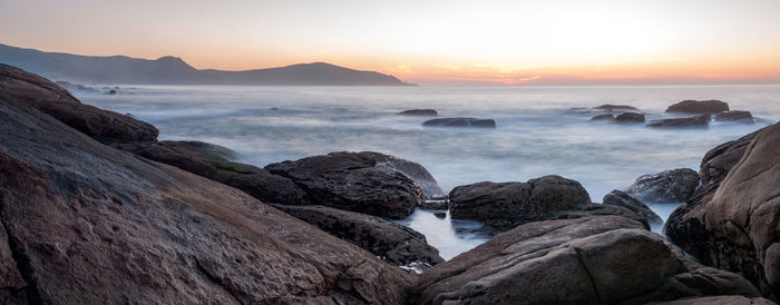 Scenic view of sea against sky during sunset