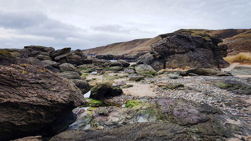 Rock formation on land against sky