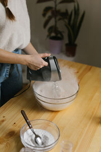 Young woman making christmas cookies