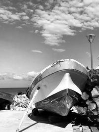 Boat on beach against sky