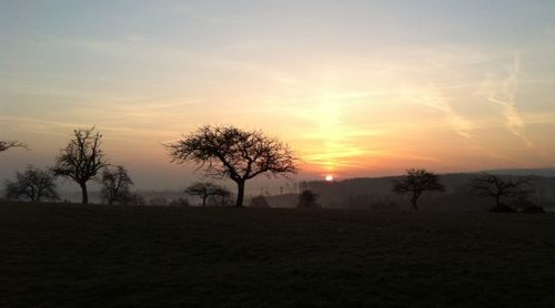 Scenic view of landscape at sunset