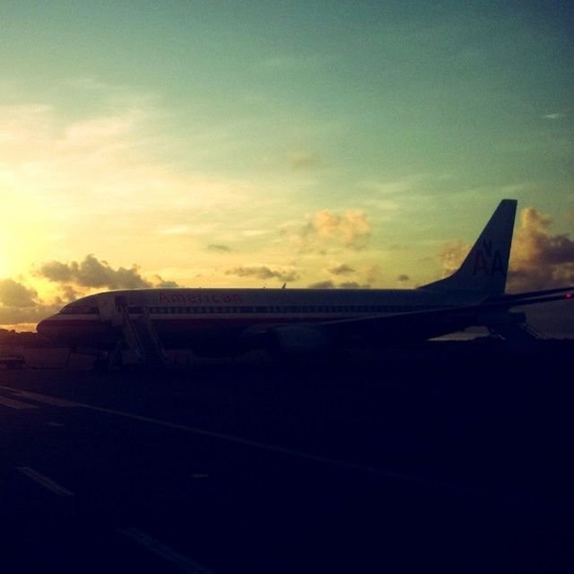 transportation, mode of transport, airplane, sky, sunset, air vehicle, cloud - sky, aircraft wing, cropped, part of, travel, cloud, on the move, public transportation, flying, cloudy, journey, orange color, no people, outdoors