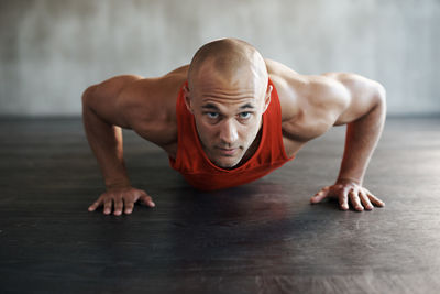 Portrait of man exercising at gym